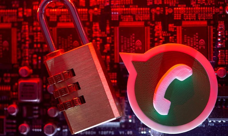 A 3D printed Whatsapp logo and a padlock are placed on a computer motherboard in this illustration picture taken May 4, 2021. — Reuters