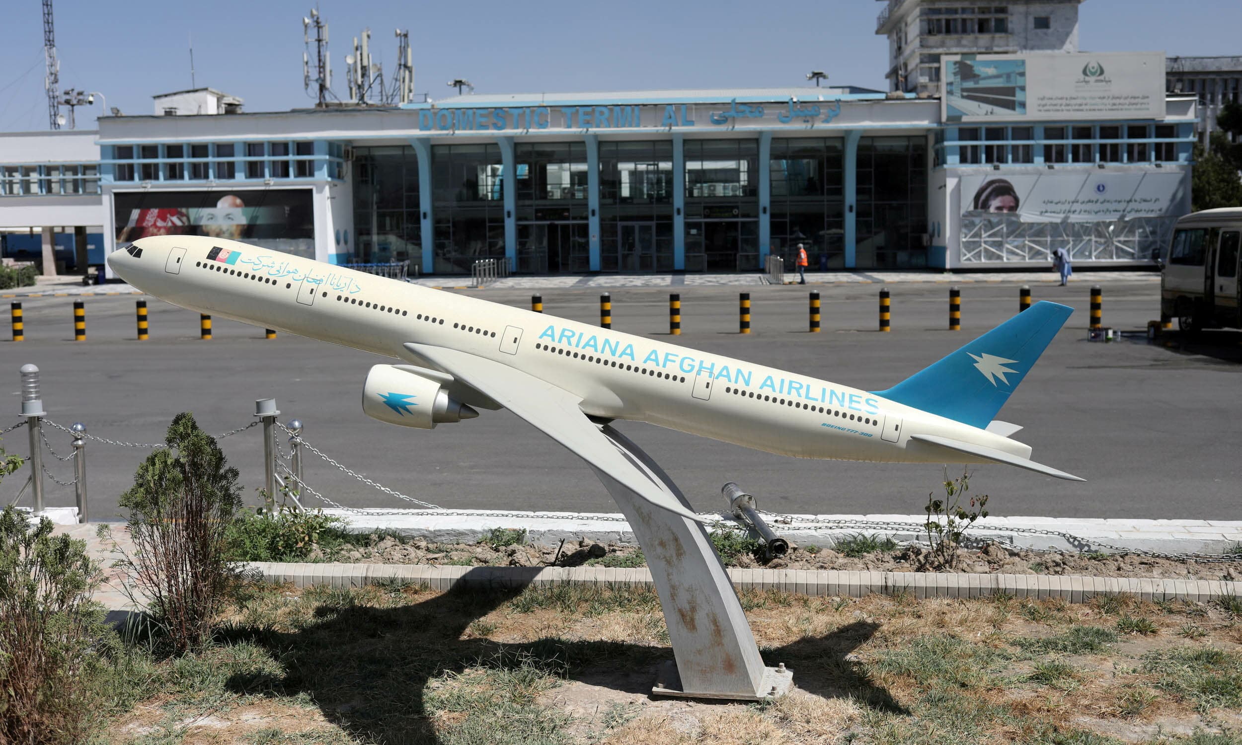 A model of an Ariana Afghan Airlines jet is seen in front of the international airport in Kabul on September 5. — Reuters