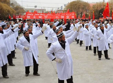 10-2-15_Chinese-Imams-Forced-to-Dance.jpg