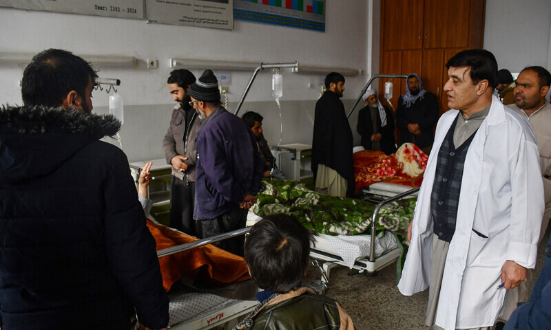 <p>Relatives visit Afghan men receiving treatment at a hospital after they were wounded when a roadside bomb hit a bus carrying employees of a petroleum company in Mazar-i- Sharif on December 6, 2022. — AFP</p>