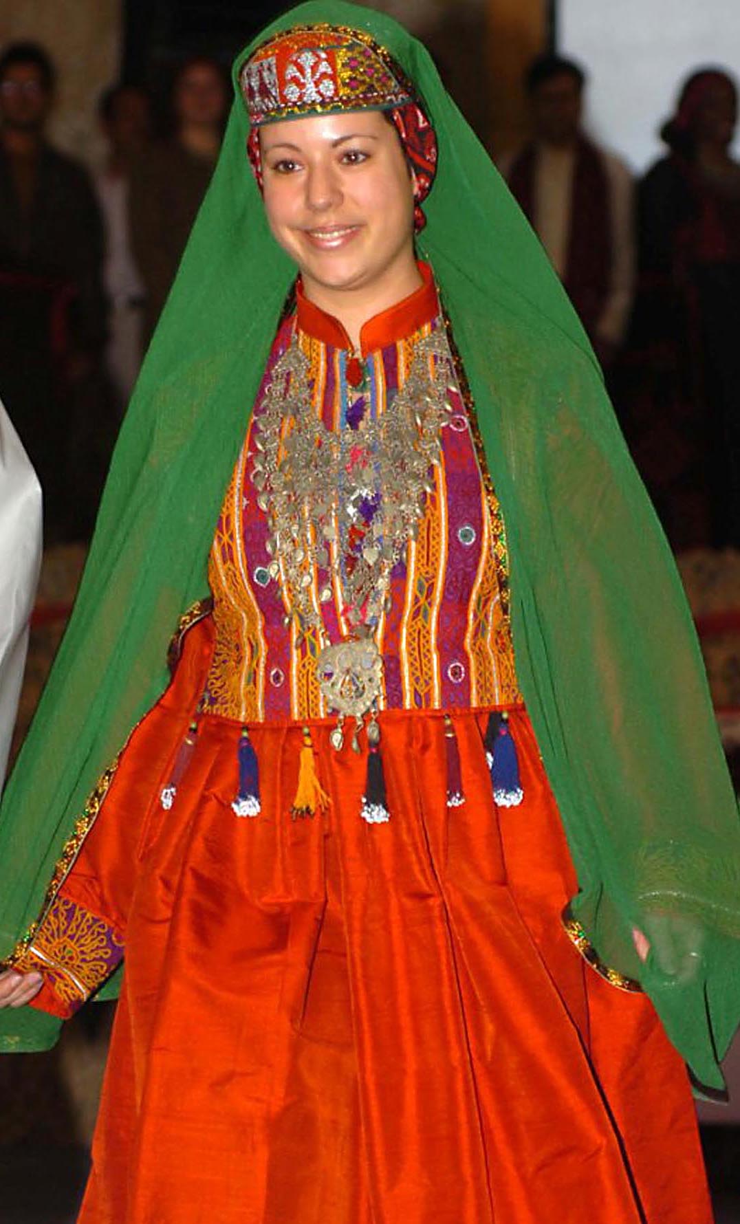 GI_walks_down_the_runway_during_a_fashion_show_dressed_in_a_colorful,_traditional_Afghan_dress._The_March_3,_2008.jpg