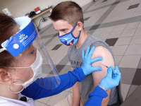Student Jack Herrington receives a dose of a coronavirus disease (COVID-19) vaccine on the campus of the University of Memphis in Memphis, Tennessee, July 22, 2021.