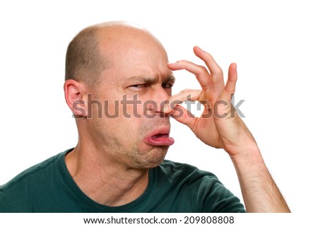 stock-photo-man-smells-something-stinky-and-pinches-his-nose-to-stop-the-bad-odor-209808808.jpg
