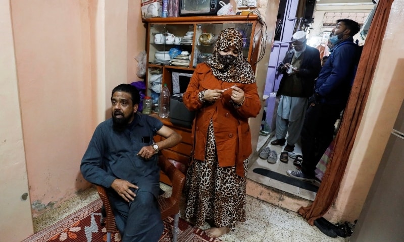 A man receives a coronavirus vaccine during a door-to-door vaccination campaign in Karachi on Tuesday. — Reuters