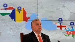 Hungarian Prime Minister Viktor Orban is backdropped by a screen showing the countries that signed a strategic energy partnership at the Cotroceni presidential palace in Bucharest, Romania, Dec. 17, 2022. 