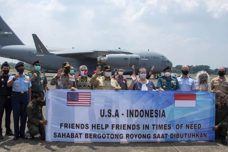 U.S. and Indonesian personnel welcome the arrival of 500 ventilators. 