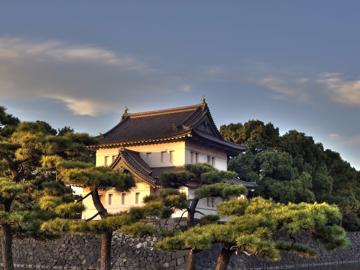 the-imperial-palace-sits-in-the-middle-of-tokyo-but-inside-of-a-vast-park-surrounded-by-a-moat-and-thick-stone-walls-its-home-to-japans-emperor-akihito-and-his-family.jpg