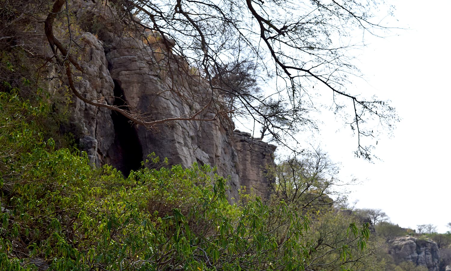 The cave entrance on the right flank of ther ock, the only entrance to Tulaja.