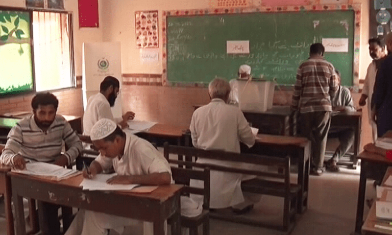 A view of a polling station in Karachi’s NA-245 constituency as voting continues on August 21, 2022. —DawnNewsTV