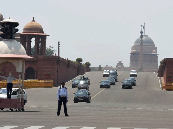 pm-s-motorcade-passes-from-raisana-hills-after-he-submitted-his-resignation-to-the-president-14003234526426.jpg