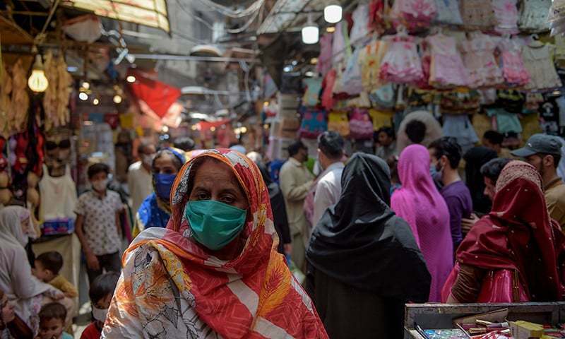 In this file photo, women shop at a market after the government eased the lockdown imposed as a preventive measure against the coronavirus in Rawalpindi. — AFP/File