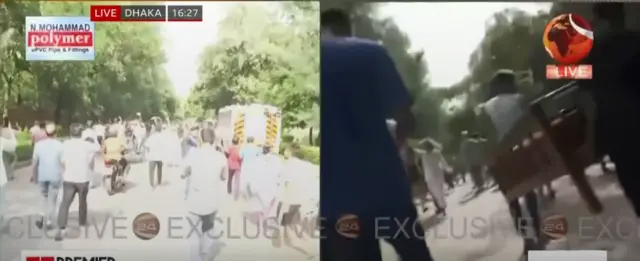 A screenshot from footage showing protesters carrying chairs and a sofa from PM Sheikh Hasina's residence in Dhaka