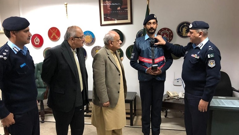 This Jan 2020 photo shows Islamabad police officials briefing the-then interior minister Syed Ijaz Shah about the usage of body worn cameras. — Picture via ICT/Twitter