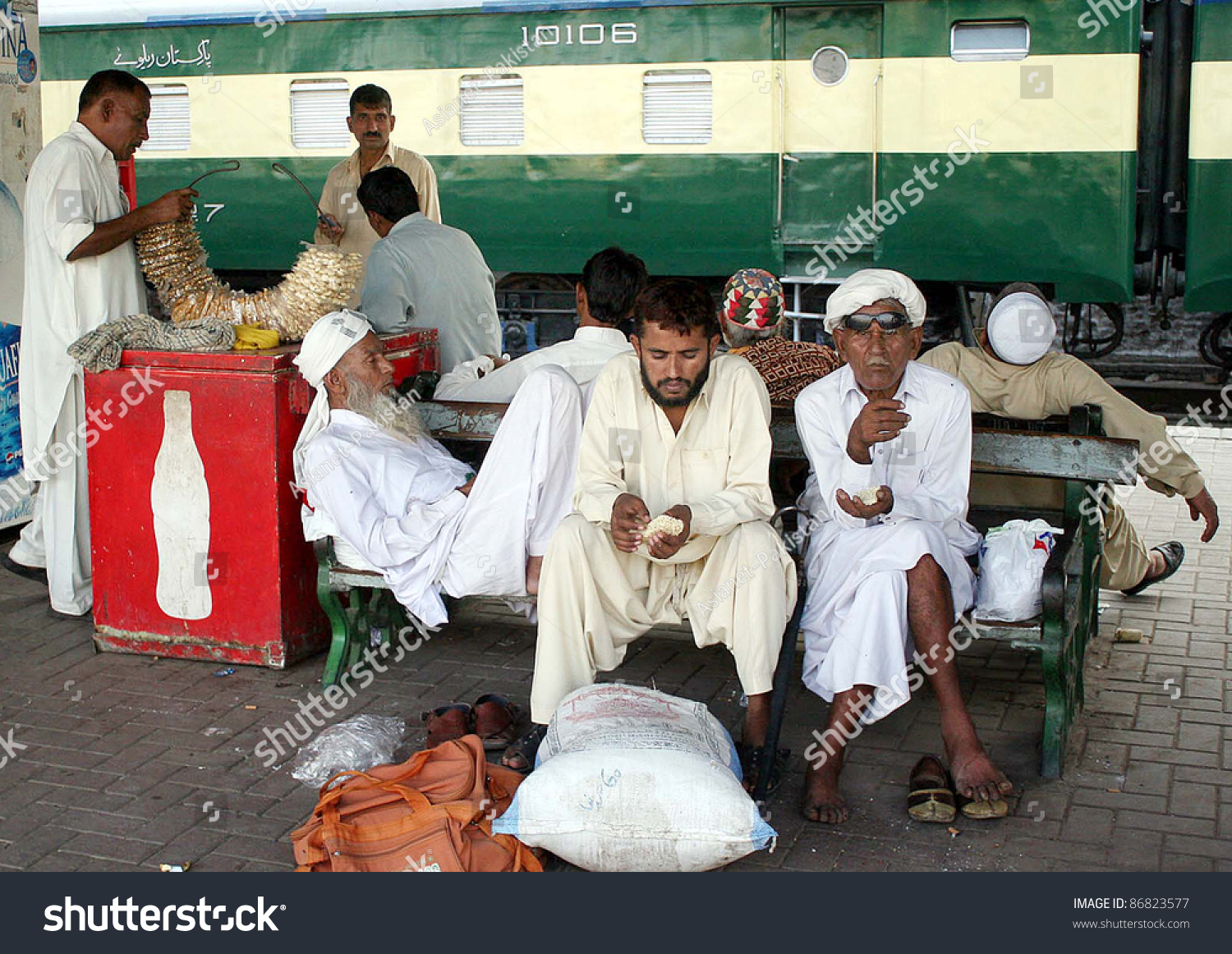 stock-photo-lahore-pakistan-oct-passengers-seen-worried-at-lahore-railway-station-due-to-protest-of-86823577.jpg