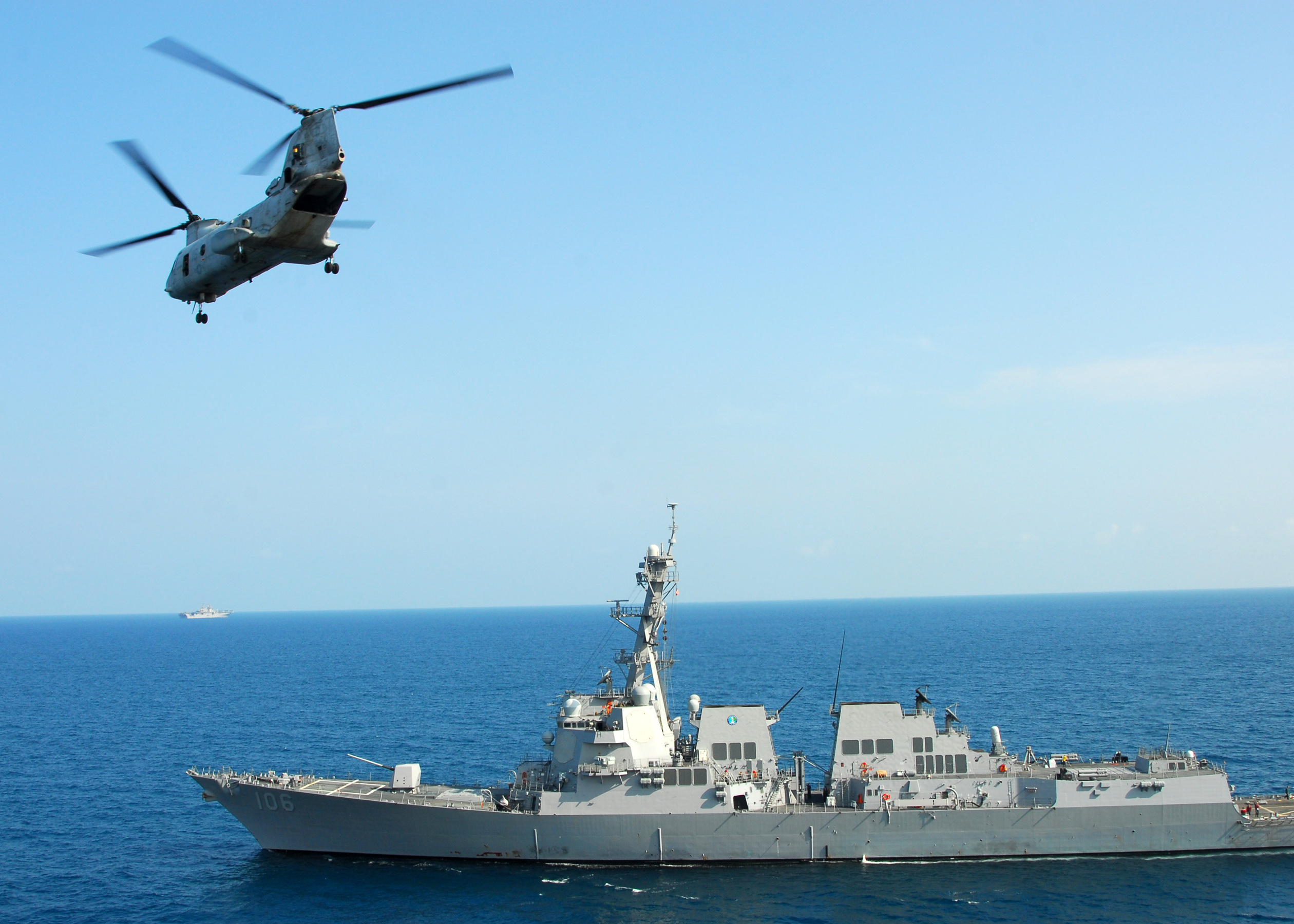 US_Navy_110217-N-8607R-204_A_CH-46E_Sea_Knight_helicopter_flies_by_the_guided-missile_destroyer_USS_Stockdale_(DDG_106).jpg