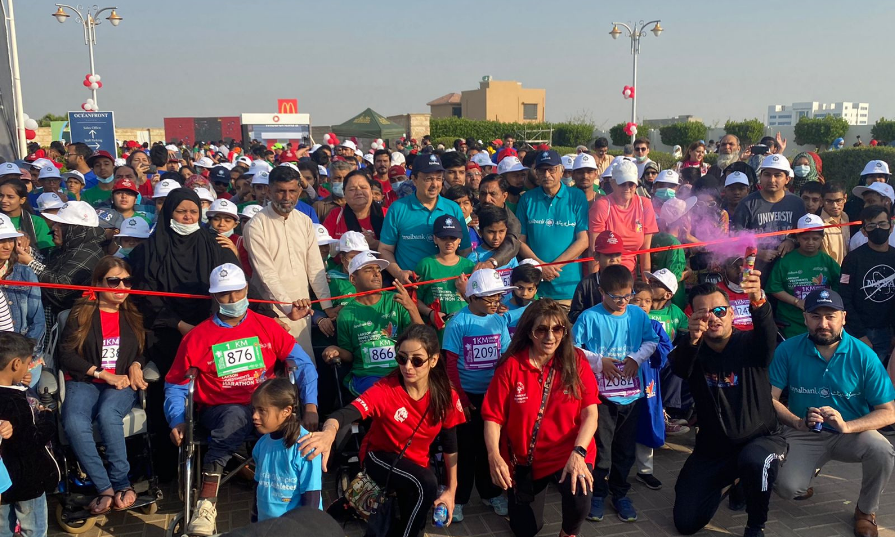 Brand Ambassador Sarwat Gillani, SOP Founder Ronak Lakhani, President and CEO Faysal Islami Yousaf Hussain and COO Faysal Islami Rahil stand at the starting line of the 1km Unified marathon.