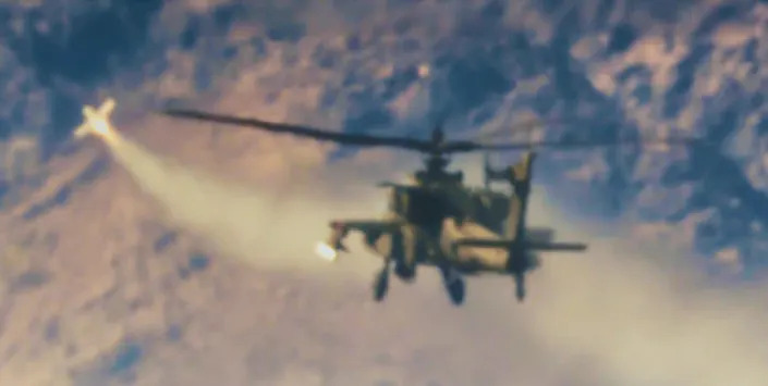 The Spike Non-Line-of-Sight missile is seen moments after leaving a U.S. Apache helicopter and heading toward its designed target. (U.S. Army)