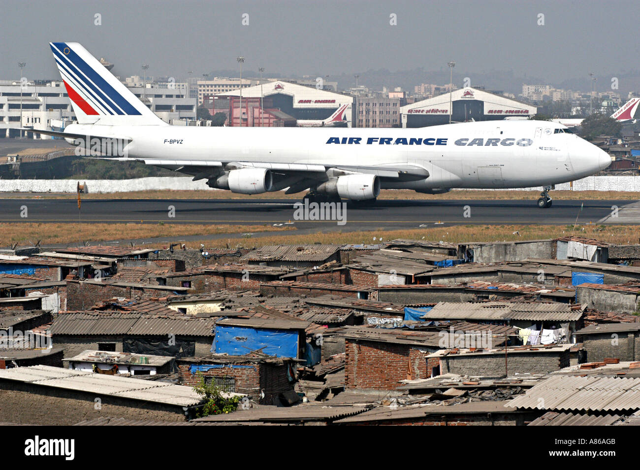 bombay-airport-with-air-france-cargo-aeroplane-and-slums-in-mumbai-A86AGB.jpg