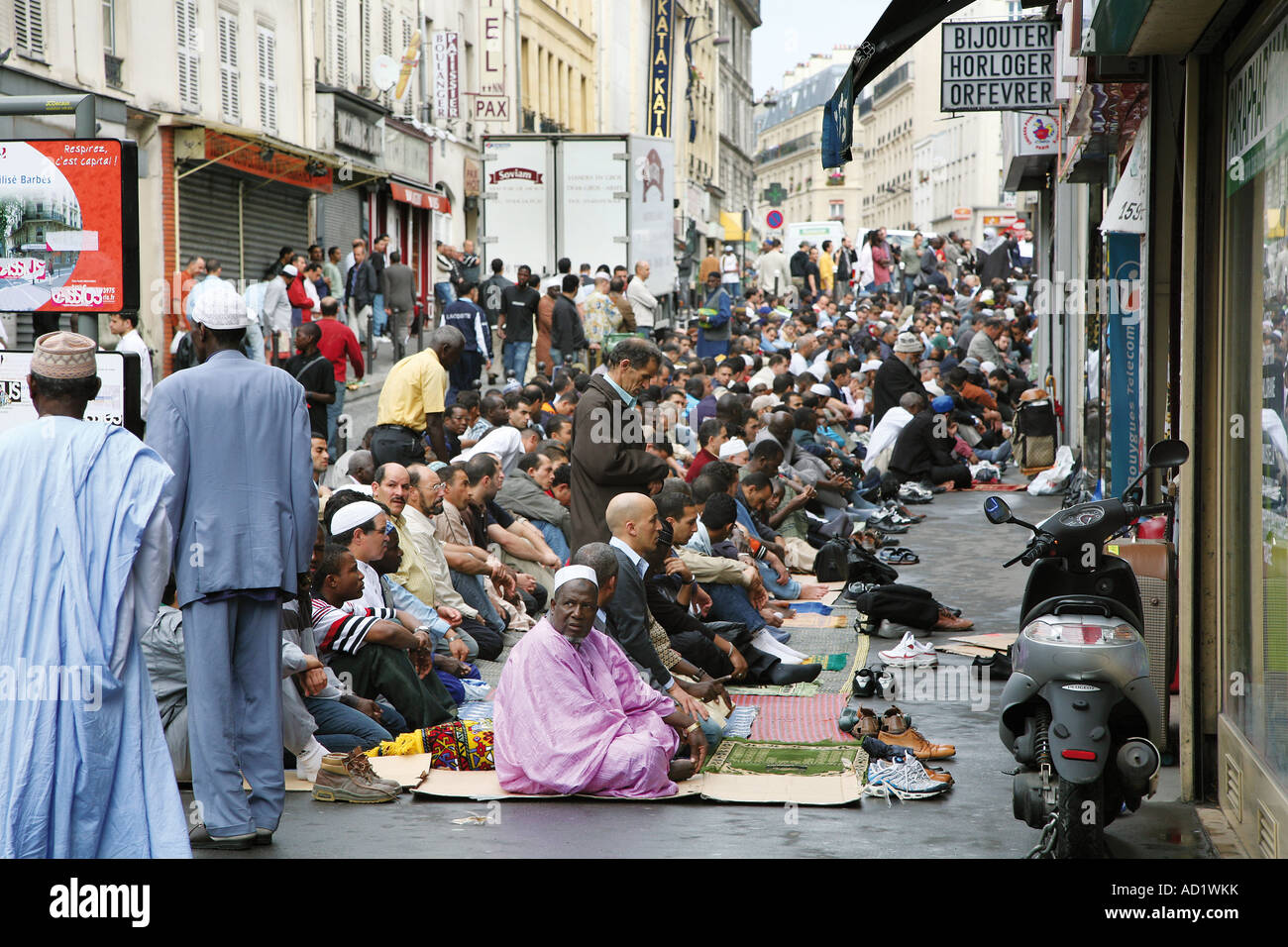 muslims-pray-out-the-mosque-in-the-barbs-rochechouart-district-of-AD1WKK.jpg