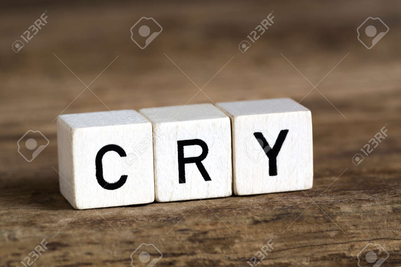 54658778-The-word-cry-written-in-cubes-on-wooden-background-Stock-Photo.jpg
