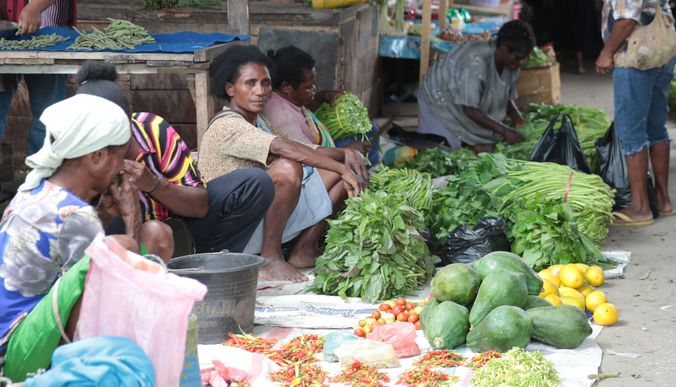 eight_col_Papuan_women_sell_produce_in_an_old_market_in_Sentani.jpg