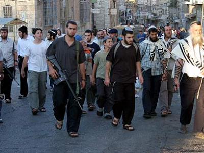 1229730175jewish_settlers_guns_hebron.jpg