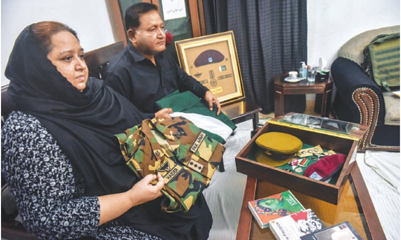 The parents of Capt Syed Haider Abbas proudly display the personal effects of their martyred son. —White Star