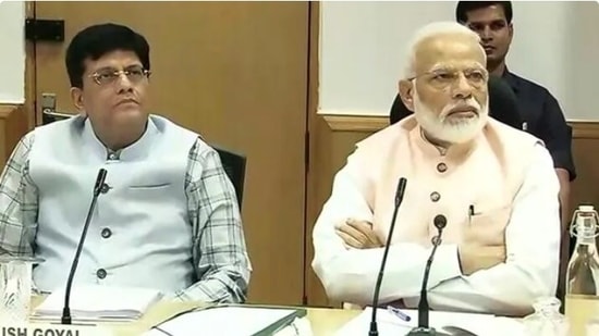 Commerce minister Piyush Goyal with PM Modi.