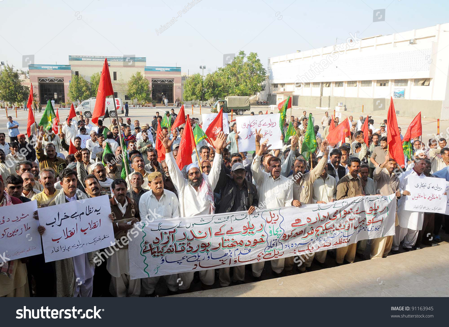 stock-photo-karachi-pakistan-dec-railway-employees-chant-slogans-in-favor-of-their-demands-during-91163945.jpg