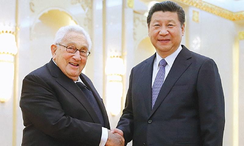 In this file photo, Chinese President Xi Jinping shakes hands with former US secretary of state Henry Kissinger at the Great Hall of the People in Beijing.— Reuters/File