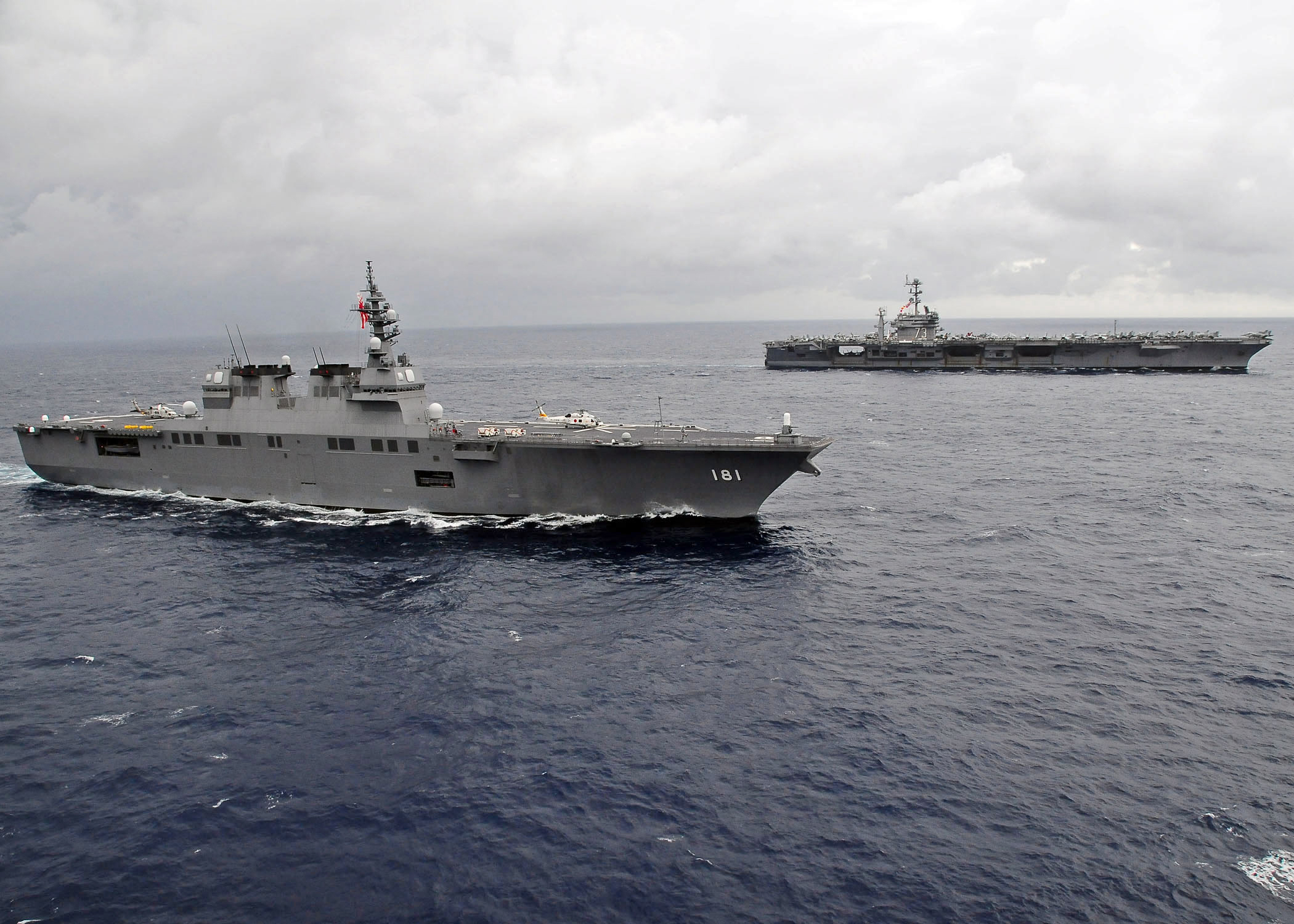 US_Navy_091117-N-1644H-087_The_Japan_Maritime_Self-Defense_Force_helicopter_destroyer_JS_Hyuga_(DDH_181)_is_underway_alongside_the_aircraft_carrier_USS_George_Washington_(CVN_73).jpg
