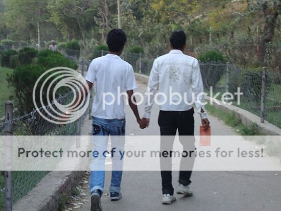 112686751552-indian-men-holding-hands-as-a-sign-of-friend.jpg