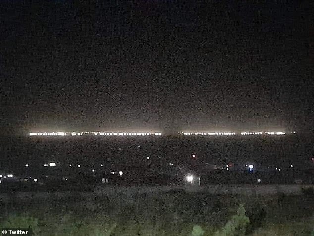 Images circulating on social media appear to show the airbase's floodlights blazing in the distance for the first time since US forces abandoned the base in July