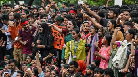 Getty Images Bangladeshi students and activists are shouting slogans during the Anti-Discrimination Student Movement rally at Central Shaheed Minar in Dhaka, Bangladesh, on August 3, 2024,
