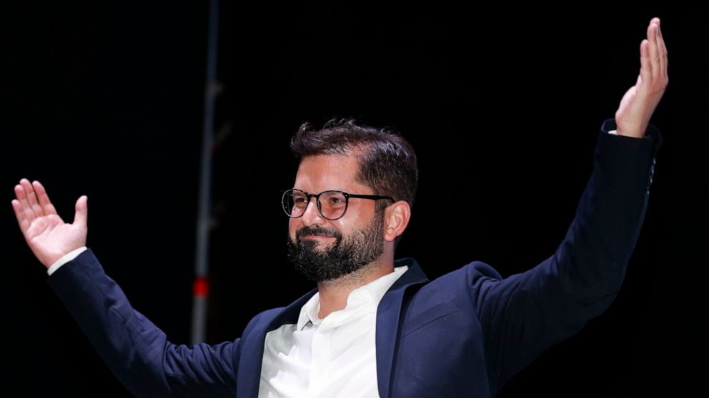 Chile's President elect Gabriel Boric, of the I approve Dignity coalition, celebrates his victory in the presidential run-off election  in Santiago, Chile, Sunday, Dec. 19, 2021. (AP Photo/Luis Hidalgo)