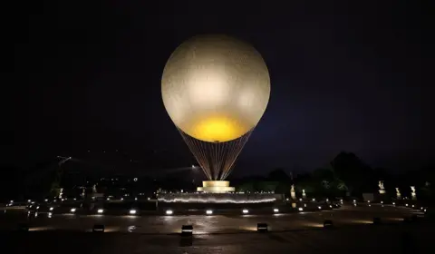  Marko Đurica/Reuters A view shows the large cauldron balloon at Jardin des Tuileries before it was lit on the day of the opening ceremony.