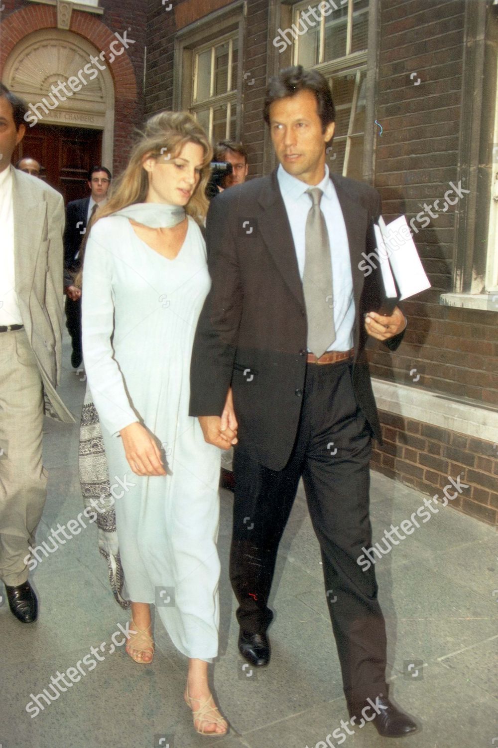 former-pakistan-cricket-captain-imran-khan-with-his-wife-jemima-khan-heads-for-a-new-clash-with-old-rival-ian-botham-this-time-in-court-ian-botham-and-allan-lamb-are-suing-him-for-libel-claiming-that-imran-called-them-racists-and-said-they-were-une-shutterstock-editorial-3373704a.jpg