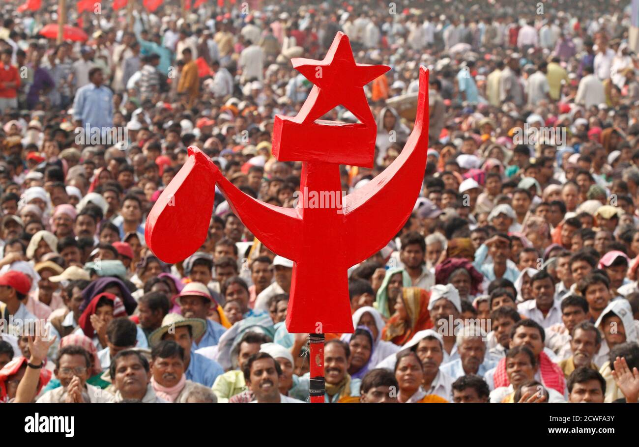 supporters-of-biman-bose-the-west-bengals-state-chief-of-the-communist-party-of-india-marxist-cpi-m-listen-to-his-speech-under-a-sign-of-cpi-m-during-the-23rd-open-party-meeting-in-kolkata-february-19-2012-reutersrupak-de-chowdhuri-india-tags-politics-2CWFA3Y.jpg
