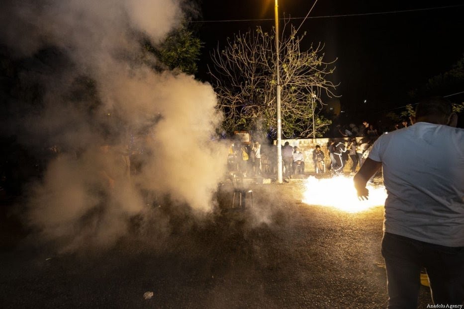 JERUSALEM - MAY 05: Israeli forces intervene in Palestinians with stun grenade during a demonstration at Sheikh Jarrah neighborhood after Israeli government's plan to force some Palestinian families out of their homes in East Jerusalem on May 05, 2021. ( Mostafa Alkharouf - Anadolu Agency )