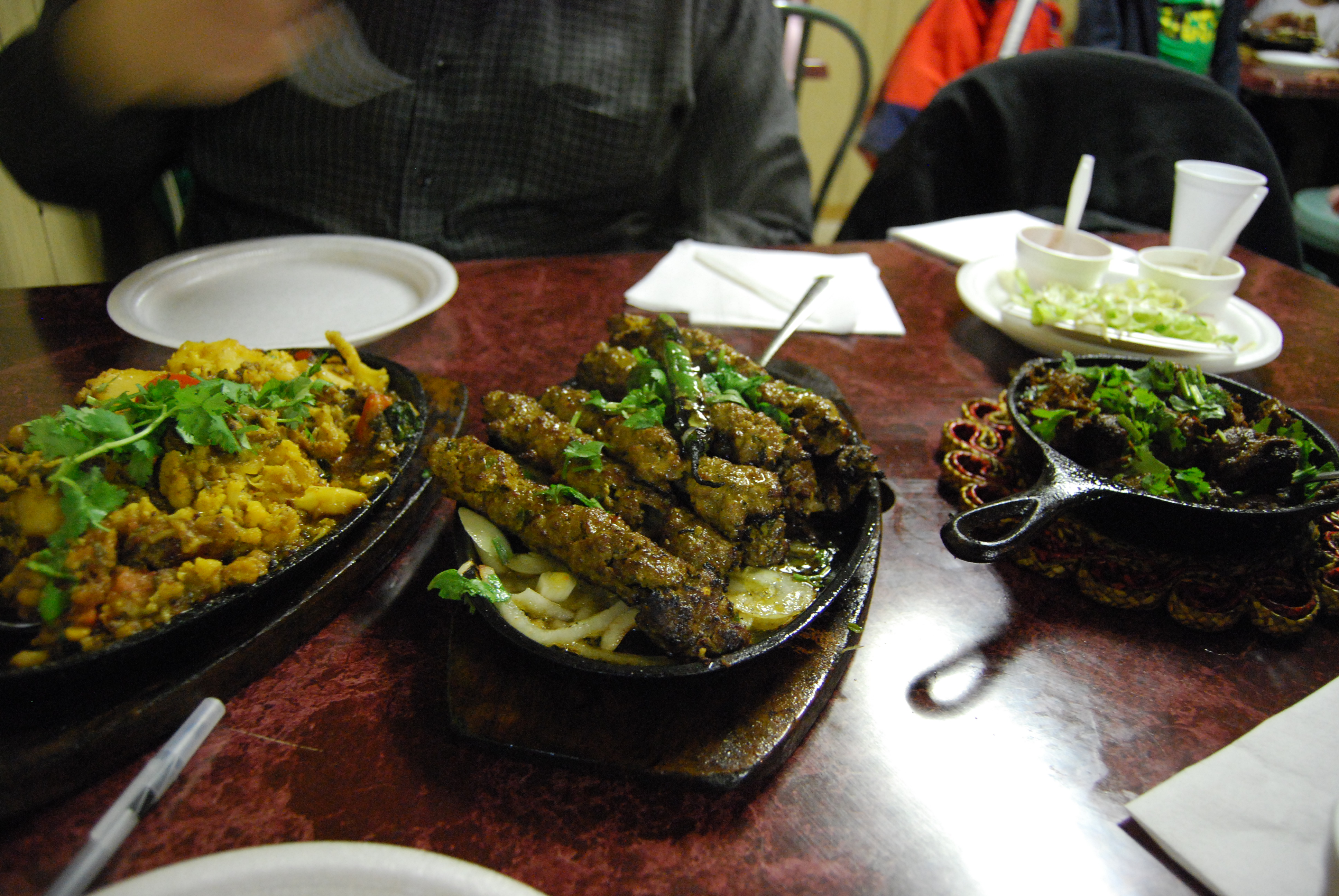 Pakistani_gobi_aloo,_seekh_kebab,_and_beef_karahi.jpg