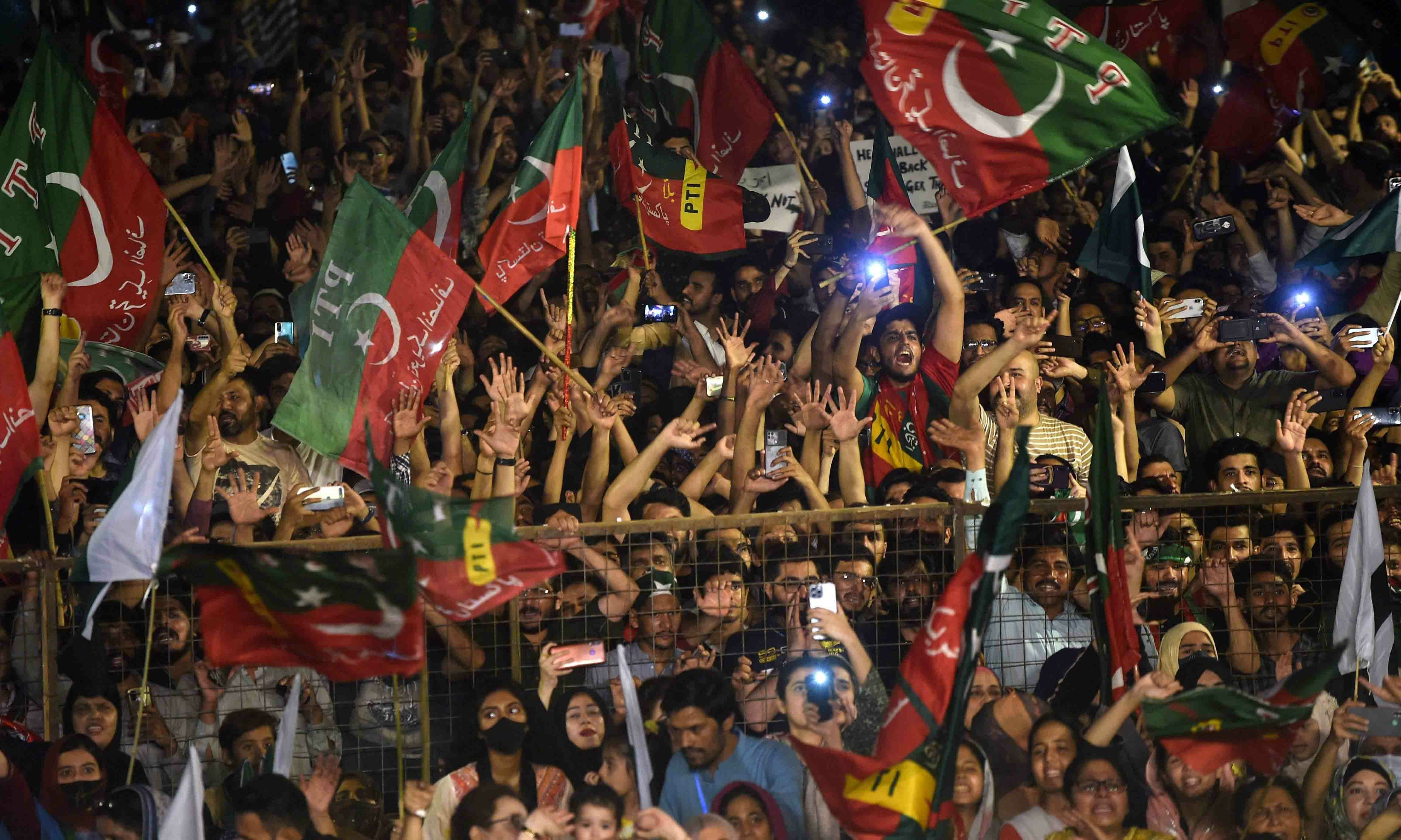 PTI supporters take part in a rally in support of former prime minister Imran Khan in Karachi on April 10. — AFP