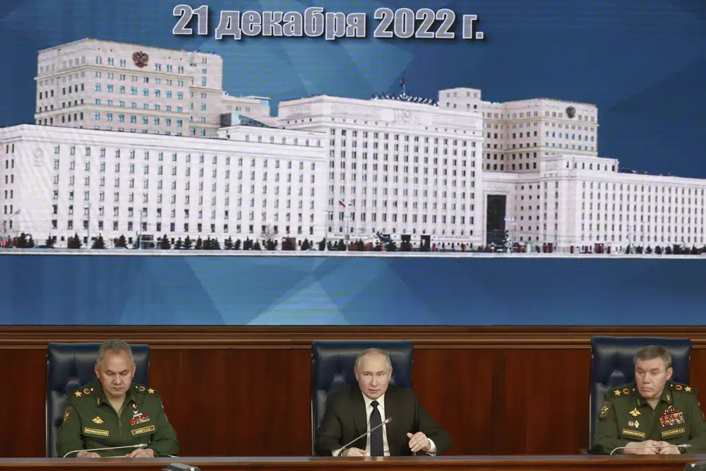 Russian President Vladimir Putin, center, speaks as Russian Defense Minister Sergei Shoigu, left, and Chief of the General Staff Gen. Valery Gerasimov attend a meeting with senior military officers in Moscow, Russia, Wednesday, Dec. 21, 2022. (Sergey Fadeichev, Sputnik, Kremlin Pool Photo via AP)