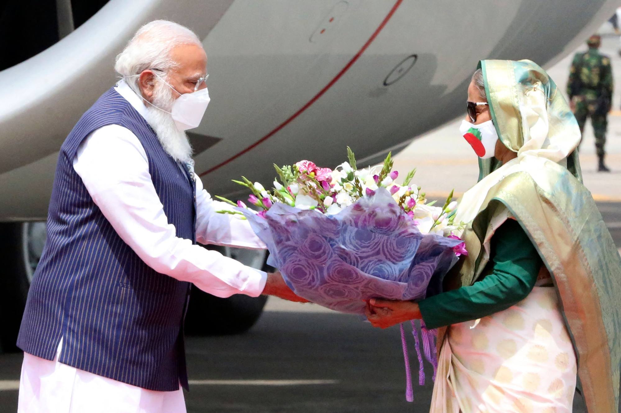 Bangladeshi Prime Minister Sheikh Hasina (right) greets her Indian counterpart, Prime Minister Narendra Modi, in Dhaka on March 26, 2021. The South Asian leaders have formed a cordial personal bond. Photo: AFP