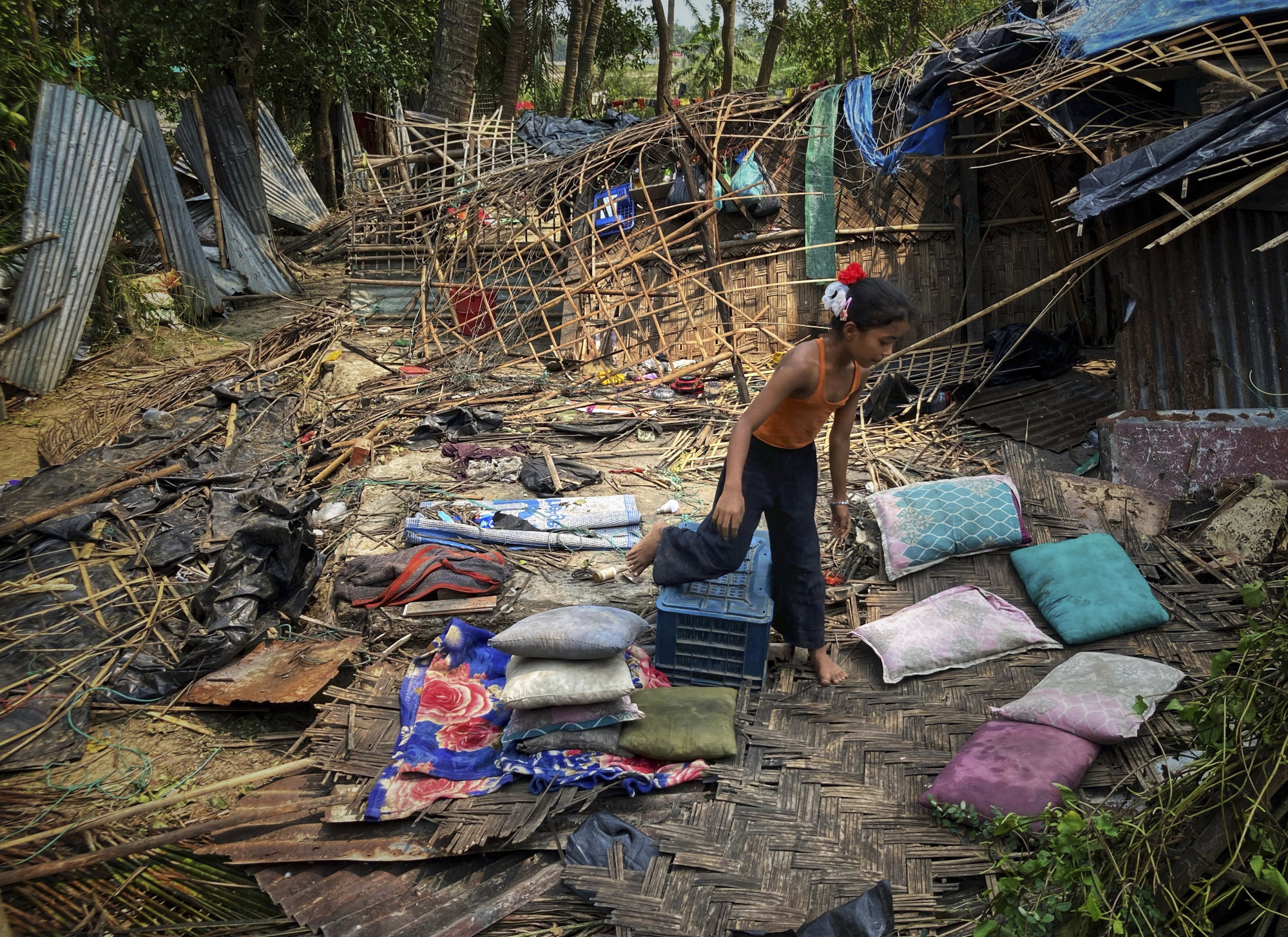 A child runs through the wreckage of her home damaged by Cyclone Mocha at Saint Martin island in Cox’s Bazar, Bangladesh, on May 15. Photo: AP