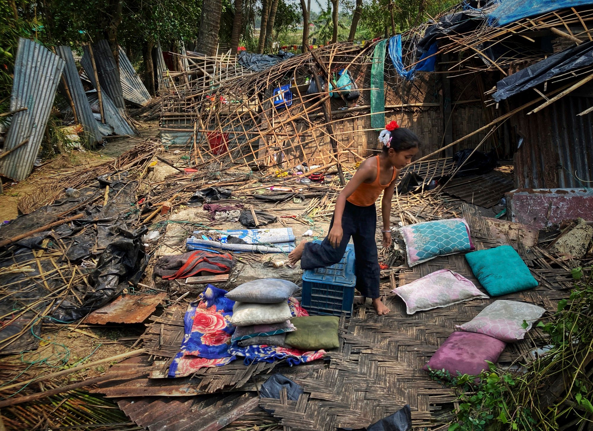 A child runs through the wreckage of her home damaged by Cyclone Mocha at Saint Martin island in Cox’s Bazar, Bangladesh, on May 15. Photo: AP