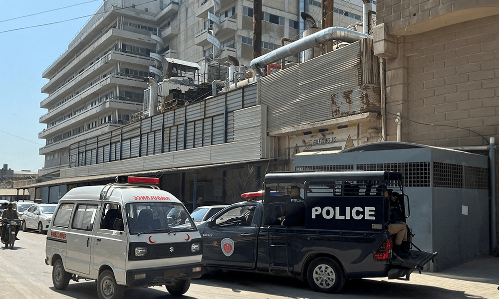 A view of a police mobile and an ambulance outside a factory where, according to police, two Chinese nationals were shot at and injured, in Karachi, Pakistan November 5, 2024. Photo: Reuters