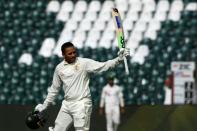 Australia's Usman Khawaja celebrates after scoring a century in the third Test in Lahore (AFP/Aamir QURESHI)