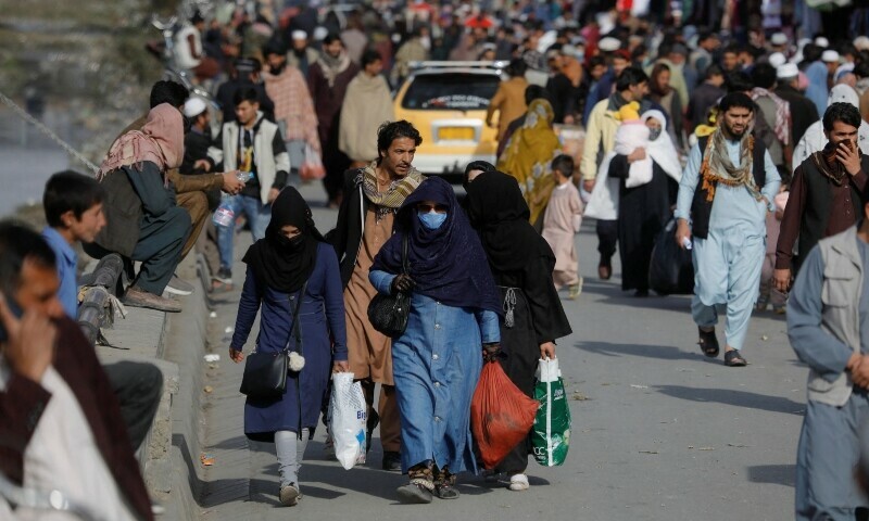<p>People walk in a street in Kabul, Afghanistan, November 9. — Reuters</p>