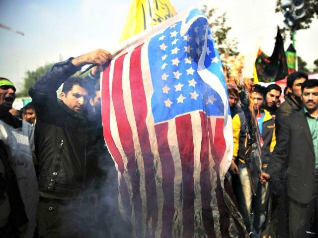 Iranians-Burn-US-Flag-APEbrahim-Noroozi.jpg