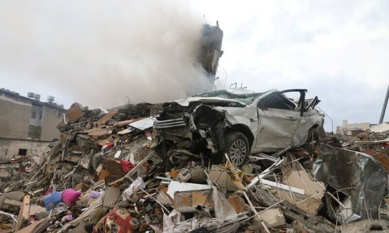 A damaged vehicle is seen on top the rubbles after an earthquake in Iskenderun, Turkiye February 6, 2023.— Reuters